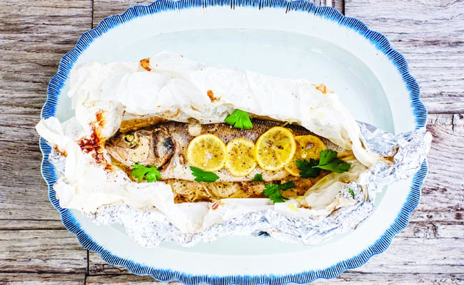 Barbecue on the beach sea bass parcels